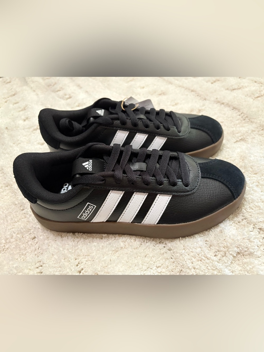adidas women’s Black Sneakers with White Stripes and Gum Sole